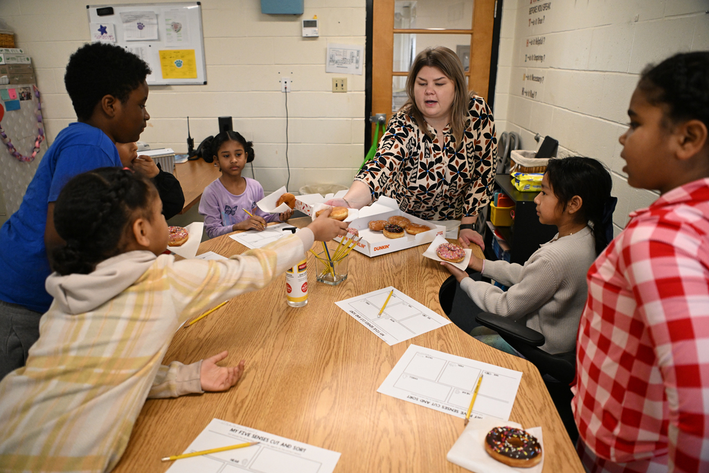 Images of Greenwood Elementary School's 2026-2027 Teacher of the Year, Ms. Carly Evans & her classroom of students.