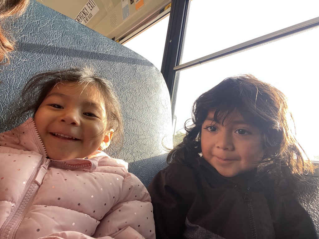 students riding the school bus