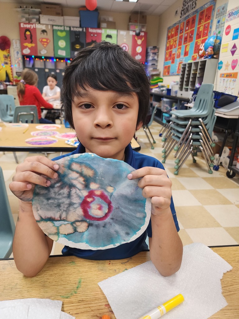 student holding project