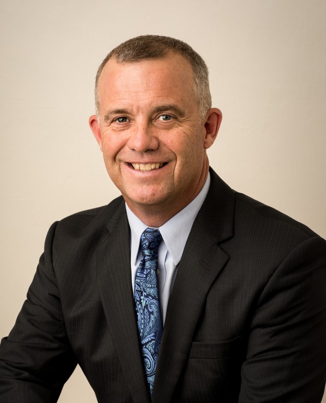 man in suit and tie smiling