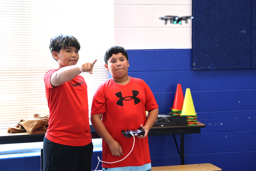students fly drone