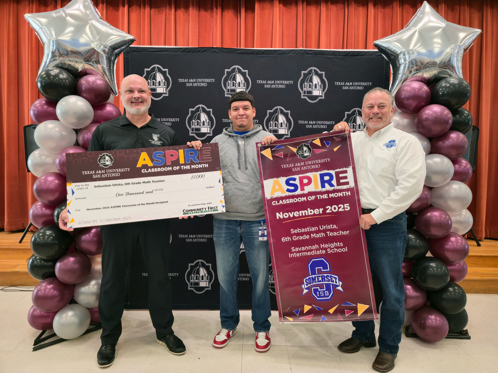 Mr. Urista with a check