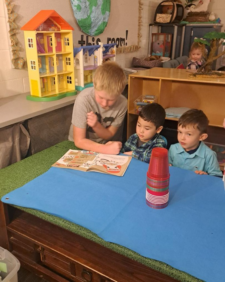 Holiday excitement filled Junior Kindergarten as Mrs. Hafner’s 4th graders stopped by to read festive stories and model the Spartan Way during playtime. 