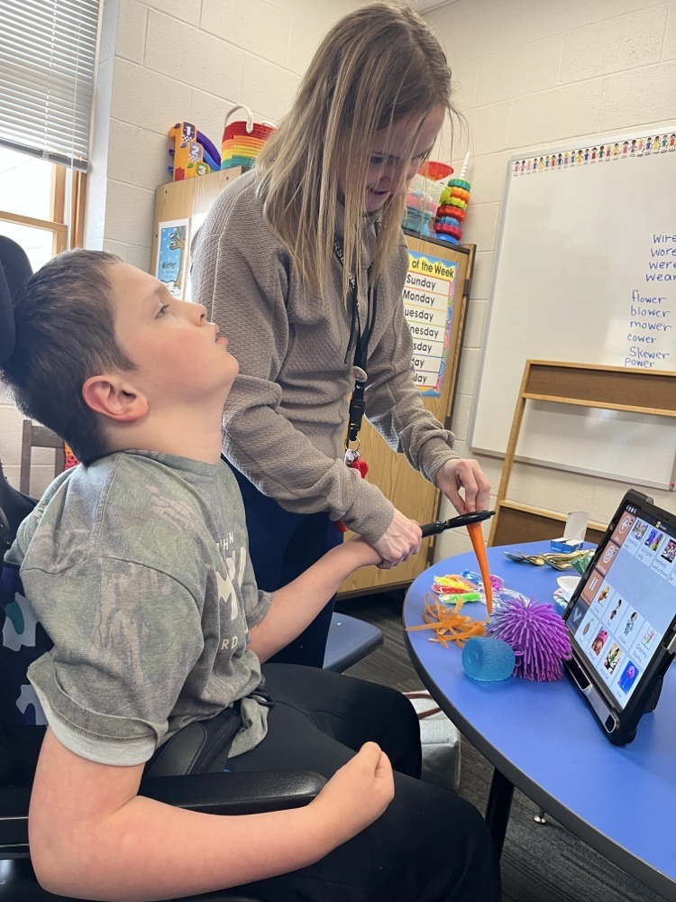 Students used cooking tools and explored different colors, smells, textures, and dip while building communication and fine motor skills.