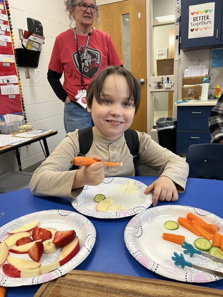 Students used cooking tools and explored different colors, smells, textures, and dip while building communication and fine motor skills.
