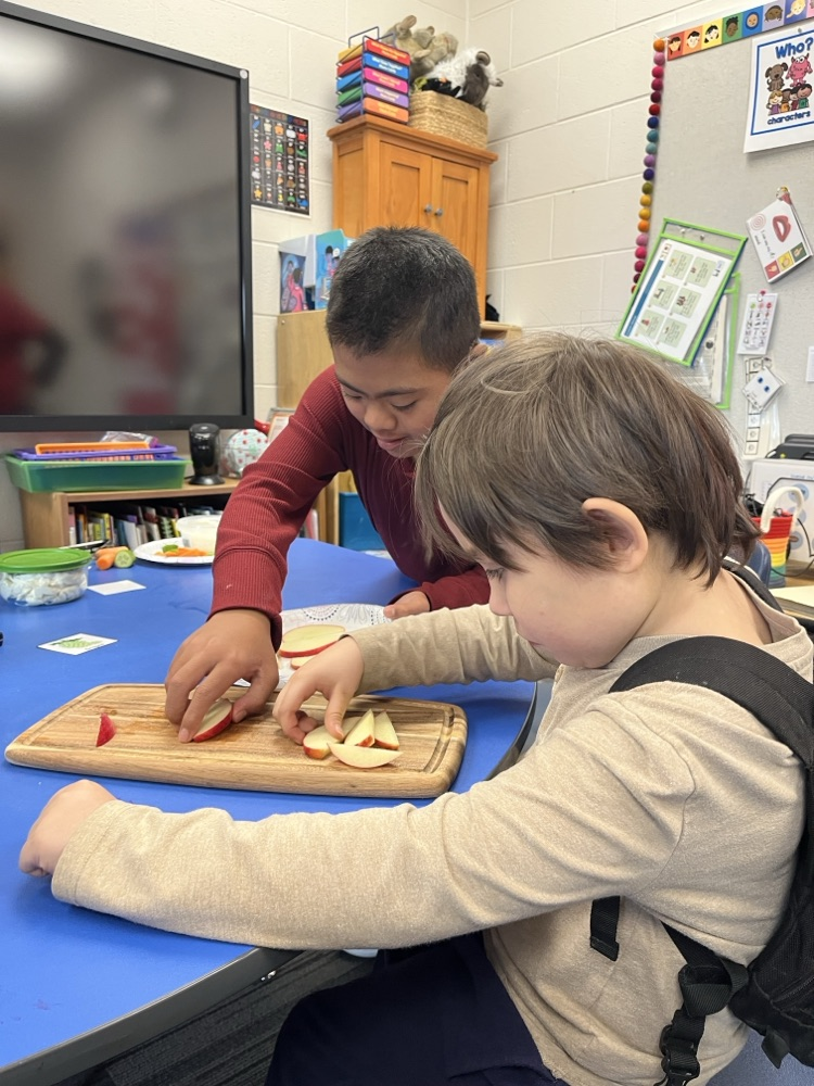 Students used cooking tools and explored different colors, smells, textures, and dip while building communication and fine motor skills.