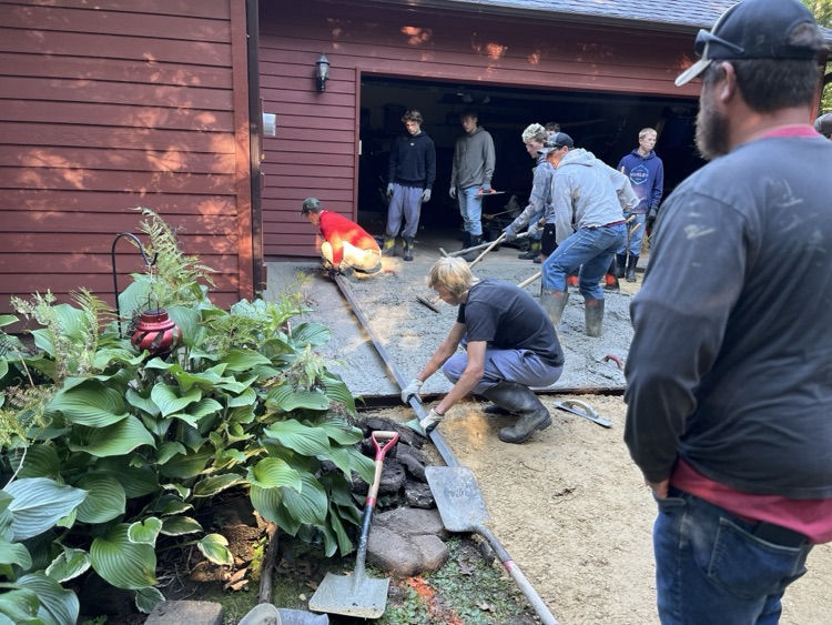 Students in Mr. Herink’s Building Construction Class gained valuable, hands-on, real-world experience yesterday as they poured a concrete apron for a community member.