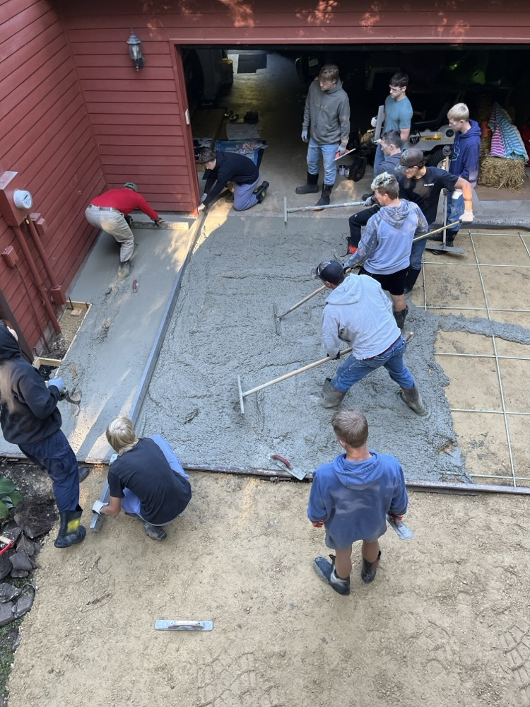 Students in Mr. Herink’s Building Construction Class gained valuable, hands-on, real-world experience yesterday as they poured a concrete apron for a community member.