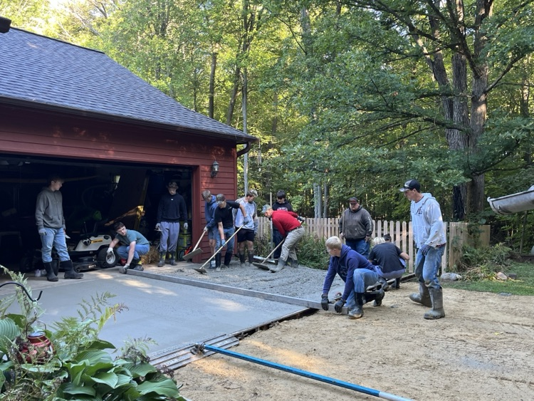 Students in Mr. Herink’s Building Construction Class gained valuable, hands-on, real-world experience yesterday as they poured a concrete apron for a community member.