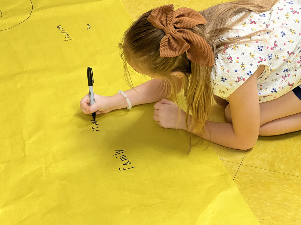 Somerville 3rd graders writing down what they're thankful for