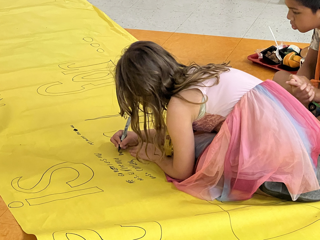 Somerville 3rd graders writing down what they're thankful for