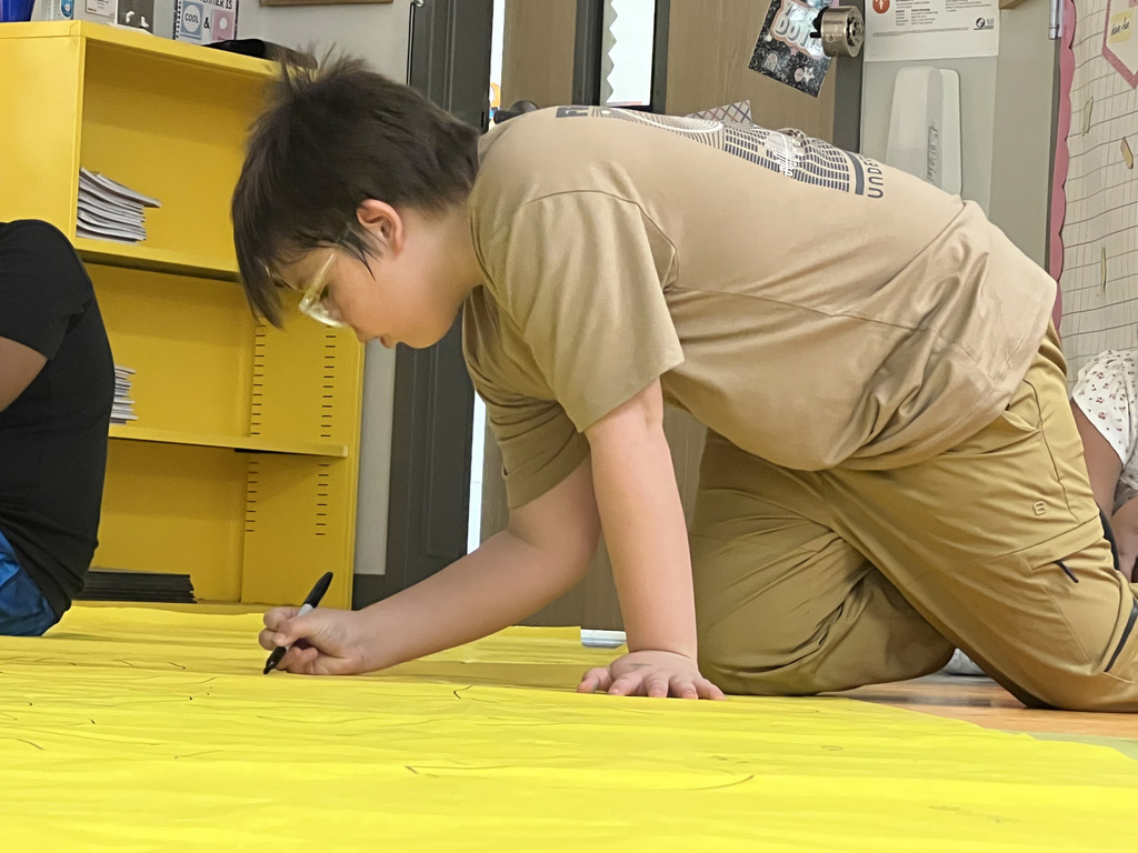 Somerville 3rd graders writing down what they're thankful for