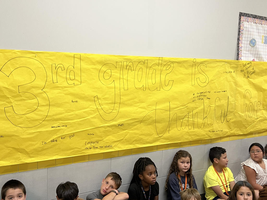 Somerville 3rd graders writing down what they're thankful for