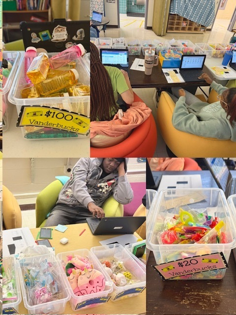 A four-panel collage shows a school reward store or prize cart setup with bins of prizes and students managing purchases using laptops.  Top left panel: A clear plastic bin filled with gold-colored rectangular containers and pink items is displayed on a table. Attached to the front is a yellow sign that reads “$100 Vanderbucks.” Behind the bin is a laptop covered with stickers, including cartoon-style characters and logos. Other prize bins are partially visible along the edges of the image.  Top right panel: Two students sit in colorful rounded lounge chairs facing laptops on a dark table. Numerous clear plastic bins filled with small prizes are arranged in rows across the table behind the computers. The bins contain toys, fidget items, novelty objects, and colorful trinkets. Papers, a water bottle, and a large tumbler sit near the laptops. The setup appears to function as a checkout station where students can redeem points or school currency.  Bottom left panel: A student sits in a bright green lounge chair 
