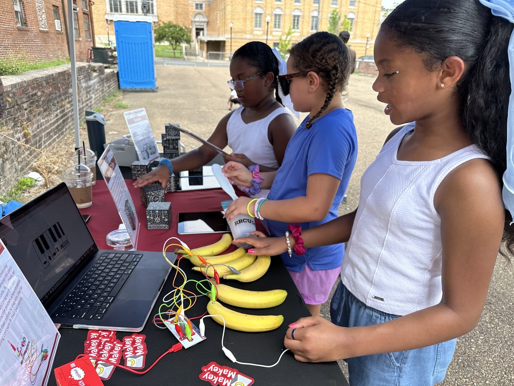 Children playing with Makey Makey banana piano