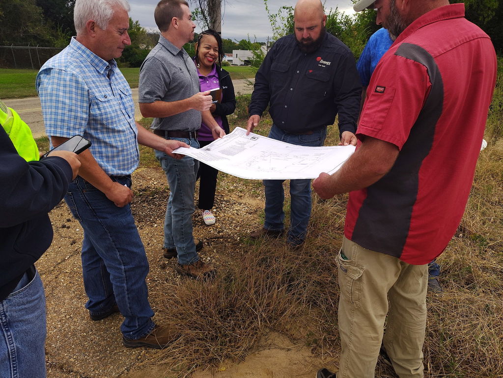 Image of architects and entergy discussing plans at Bill Howard Ballpark