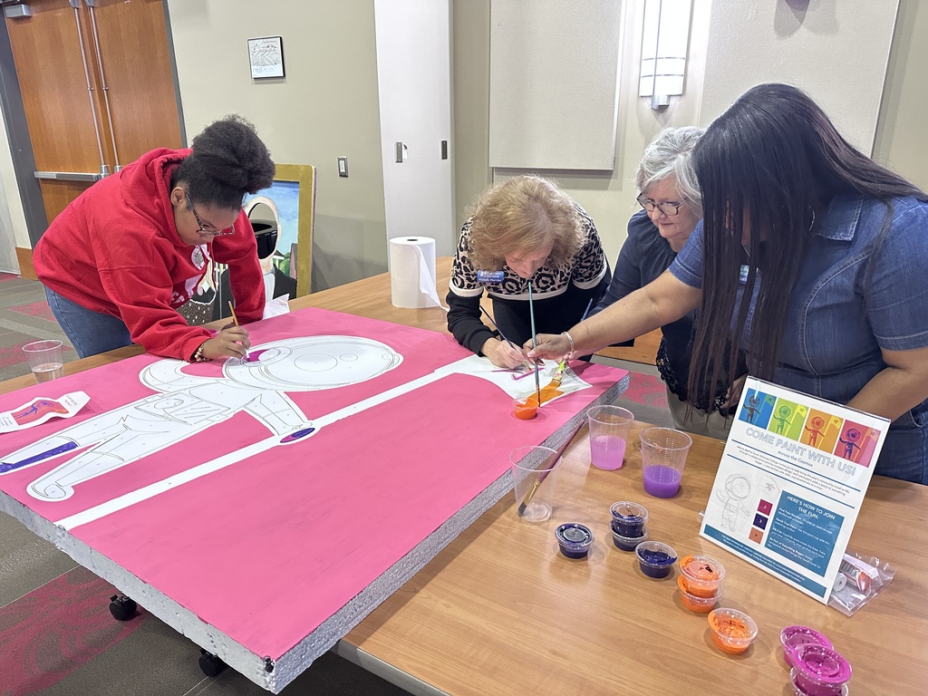 Painting Cosmo, the school mascot