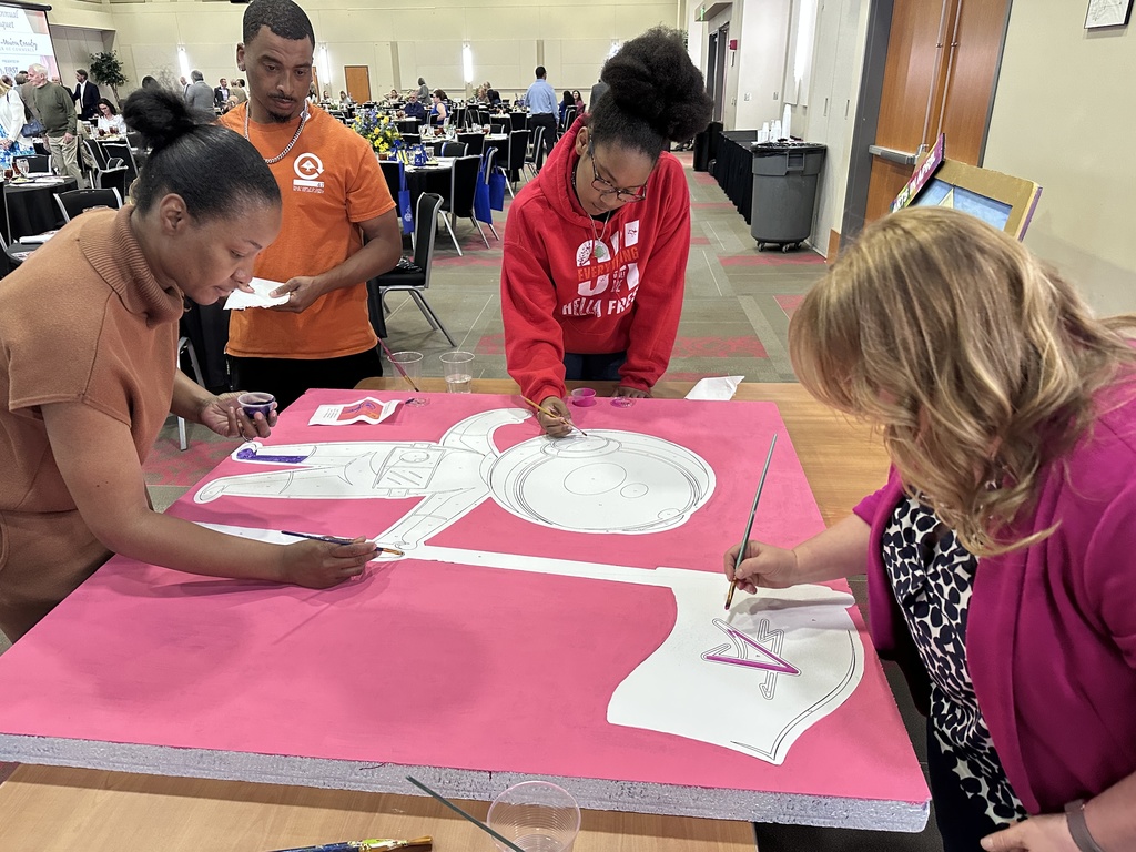 Painting Cosmo, the school mascot