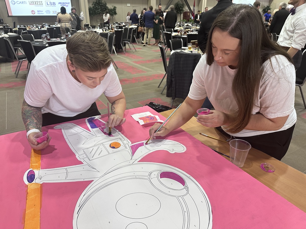 Painting Cosmo, the school mascot