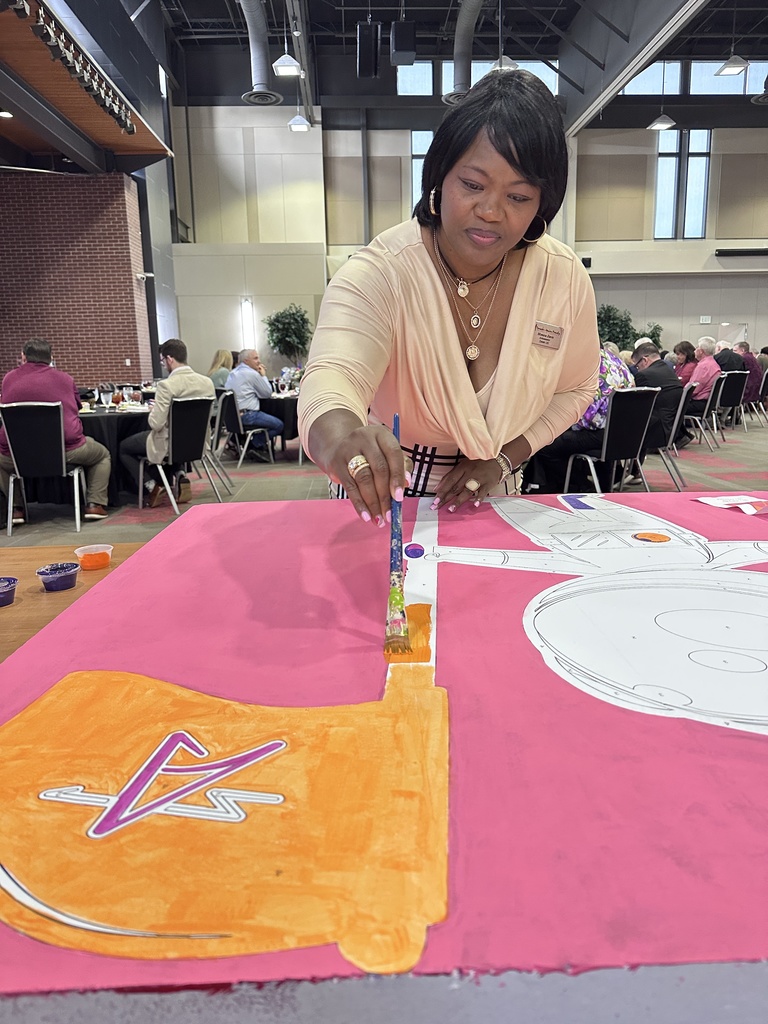 Painting Cosmo, the school mascot