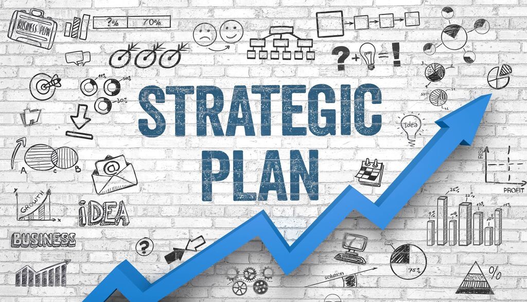 Brick wall with 'Strategic Plan' in blue letters. Below, a blue arrow ascends, symbolizing growth. Various icons and diagrams in white.