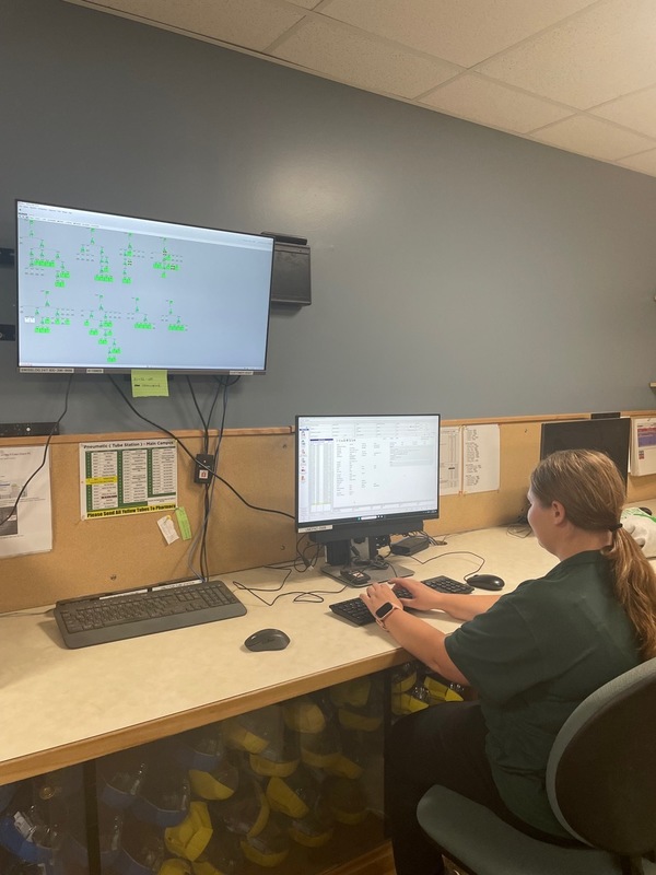 Project SEARCH worker at a company desk operating a computer