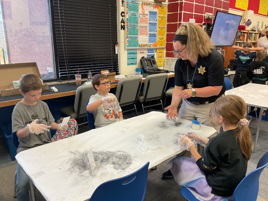 Mrs. Spencer's library classes were treated to some special guests who helped them understand investigative techniques.