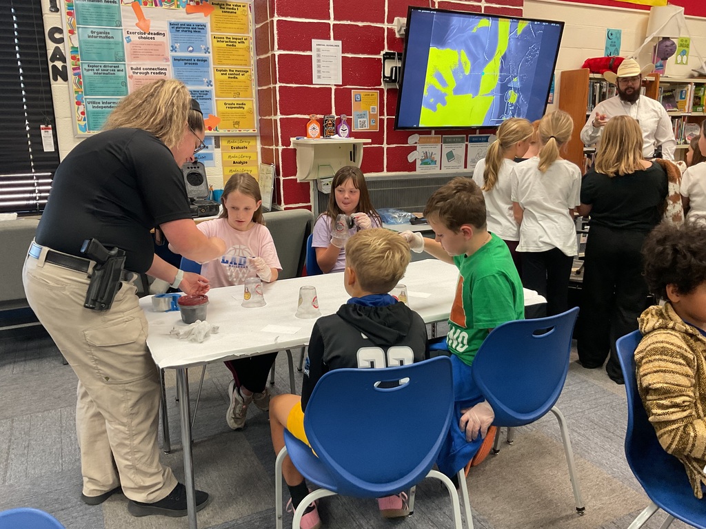 Mrs. Spencer's library classes were treated to some special guests who helped them understand investigative techniques.