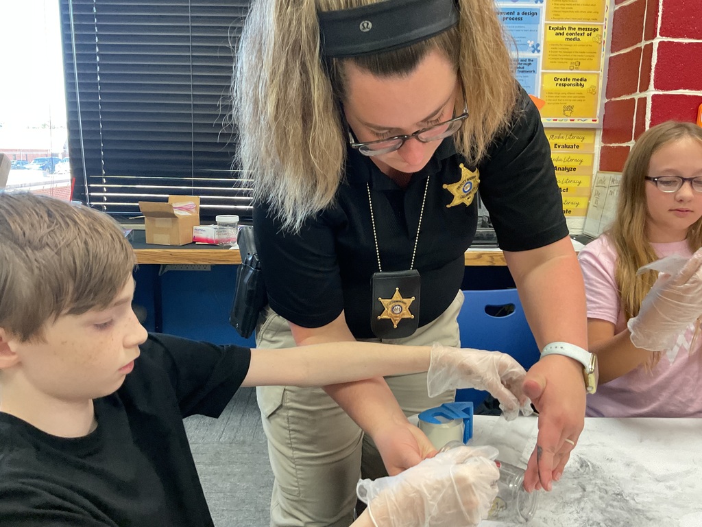 Mrs. Spencer's library classes were treated to some special guests who helped them understand investigative techniques.