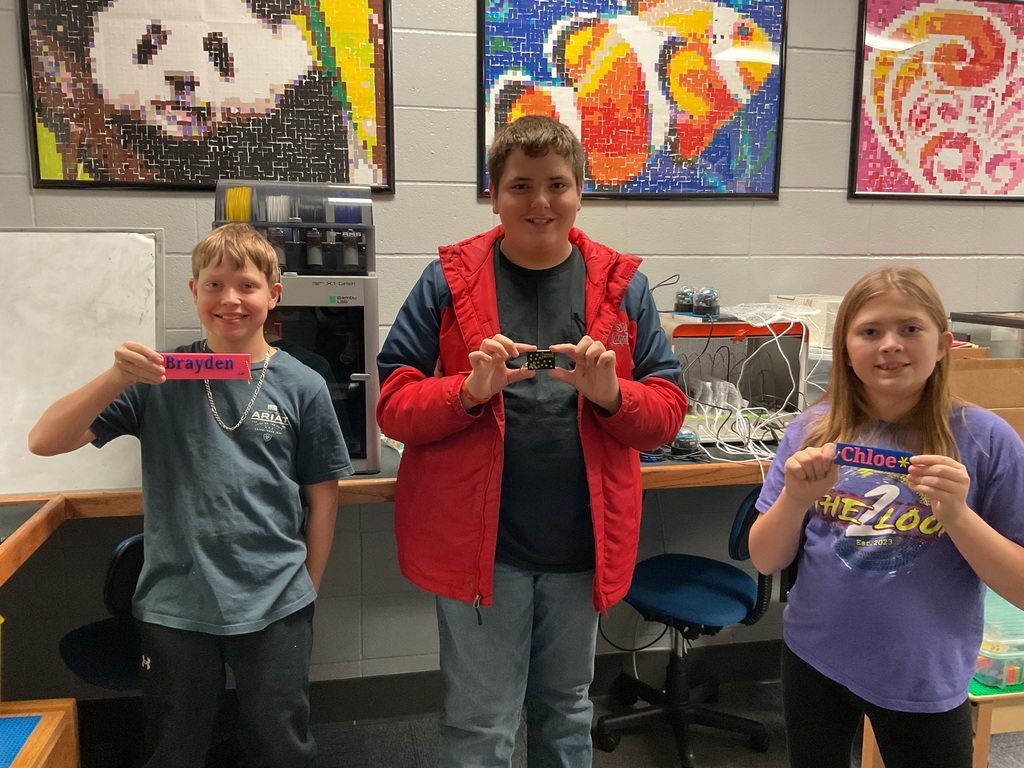 Students showing off their 3D printed keychains.