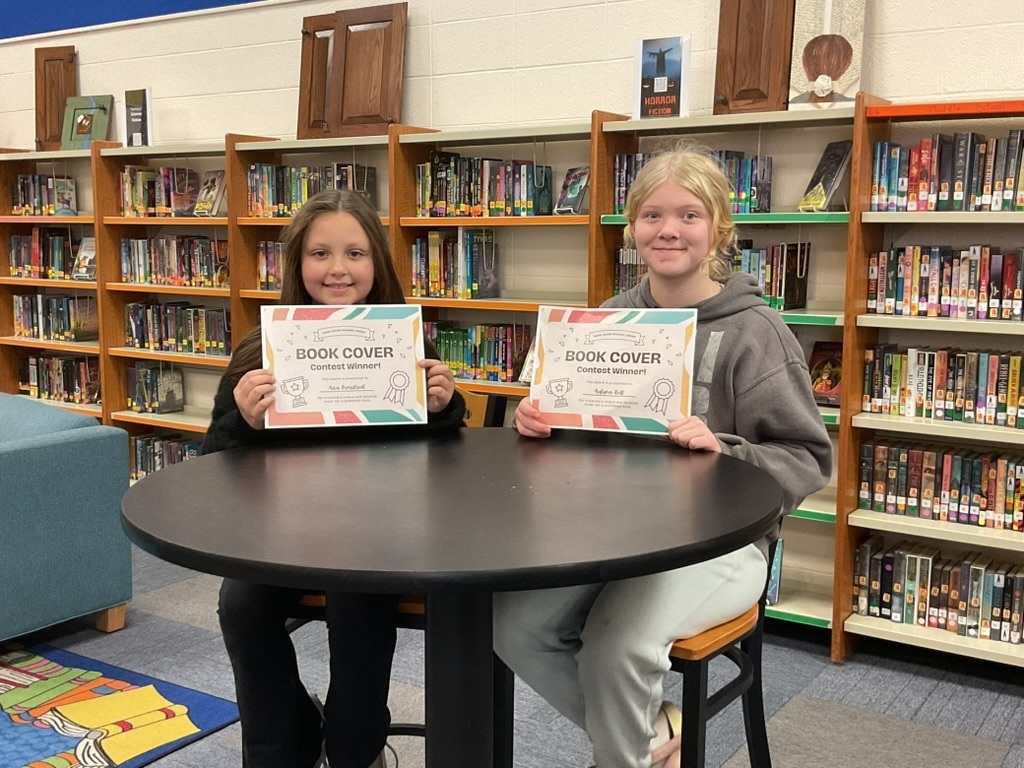 Aria and Autumn won the Daniel Boone Regional Book Cover Contest for our school.