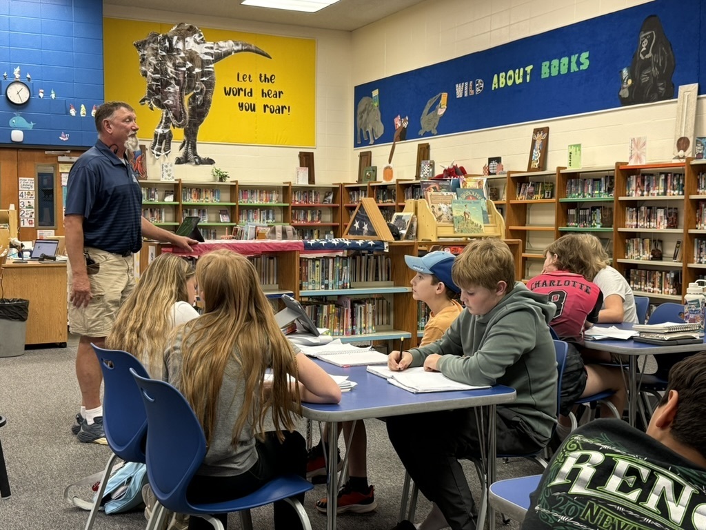 Mr. Hager talking to students.