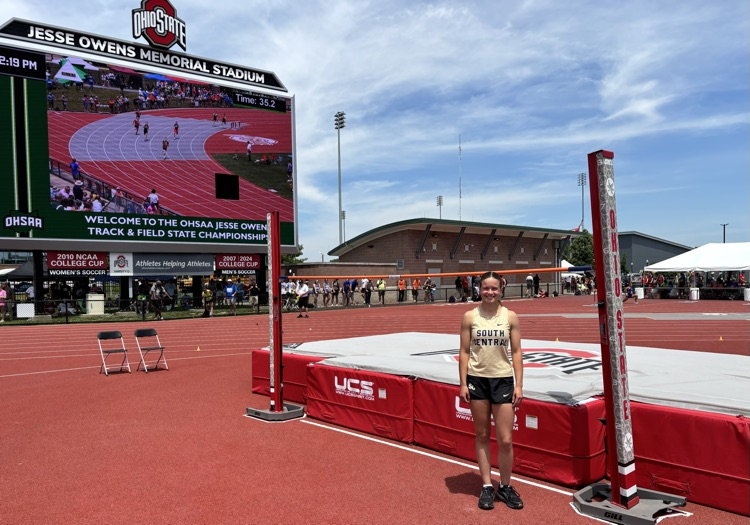 Lauren standing at the high jump pit