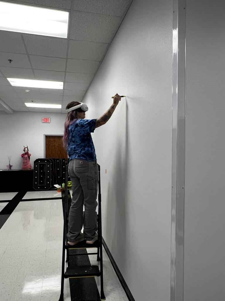 Artist drawing on wall