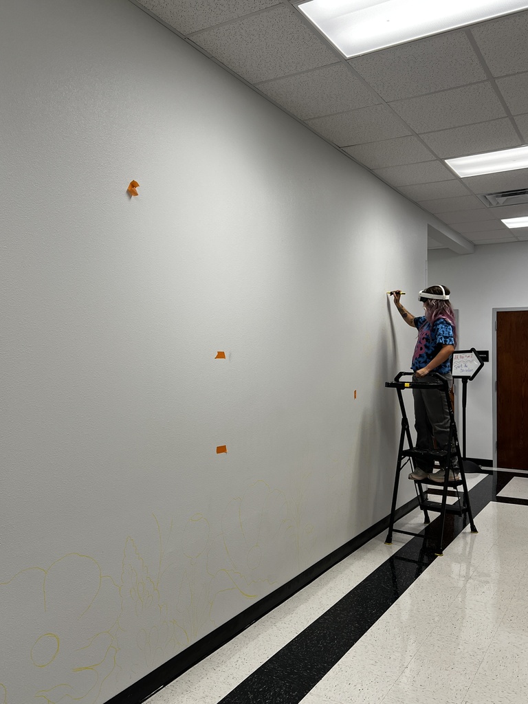 Artist drawing on wall