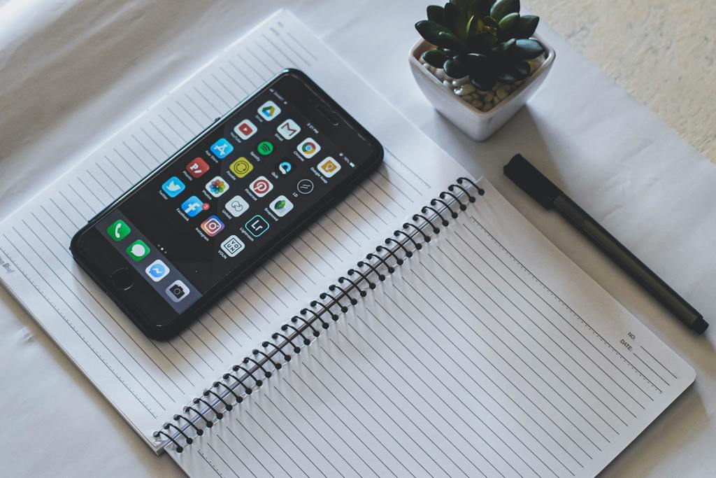 picture of a phone and a notebook