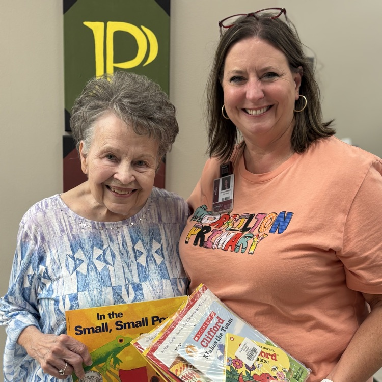 Mrs. Calhoun delivers books to Mrs. Wilson