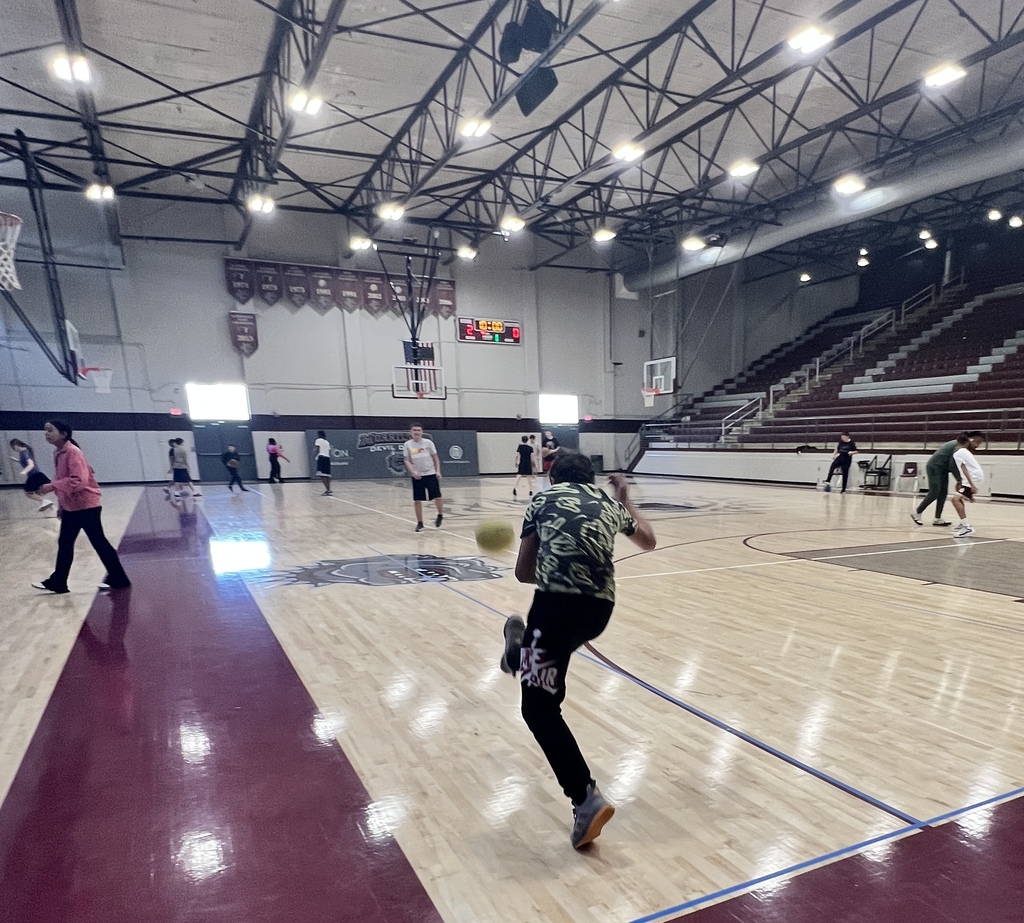 Student kicks the ball during PE time.