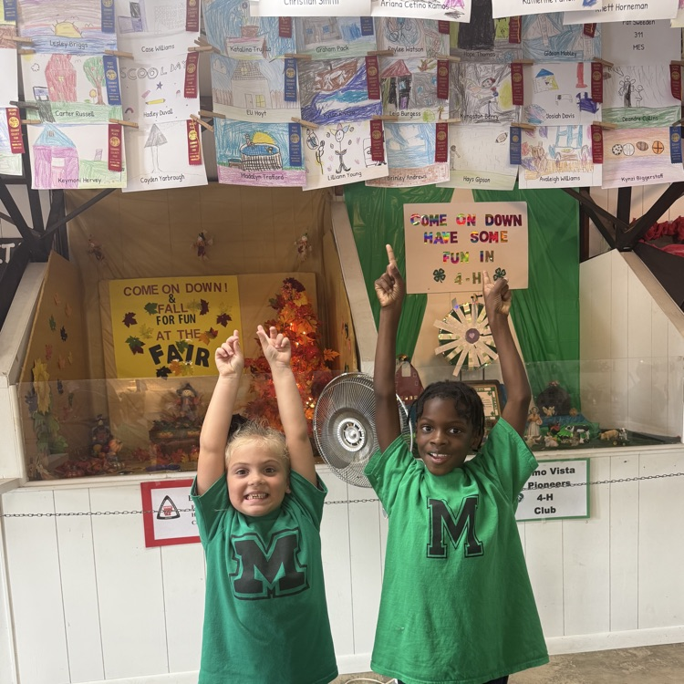 students showing our artwork at the fair 