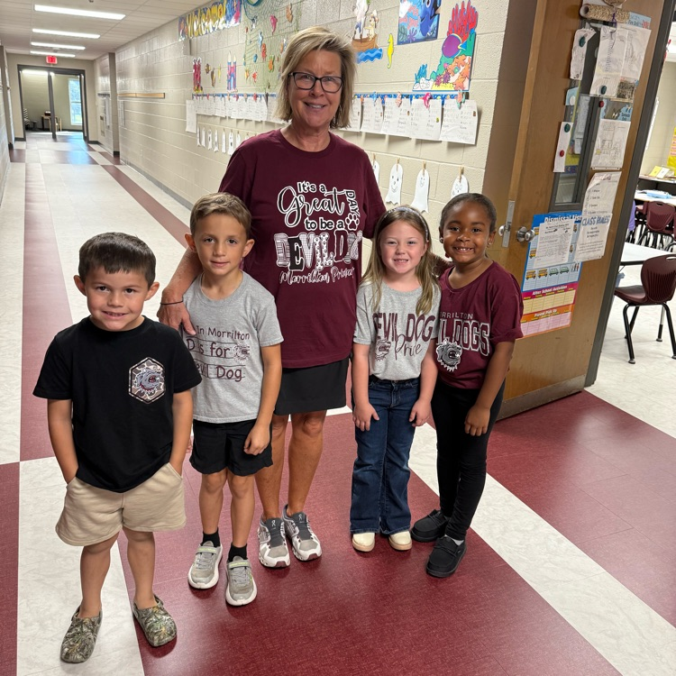 teacher and students in hall