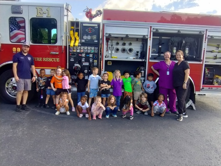 students with the fire truck