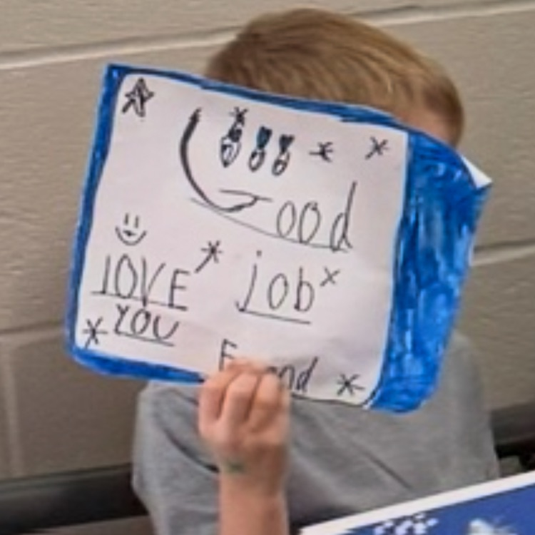 student with a sign