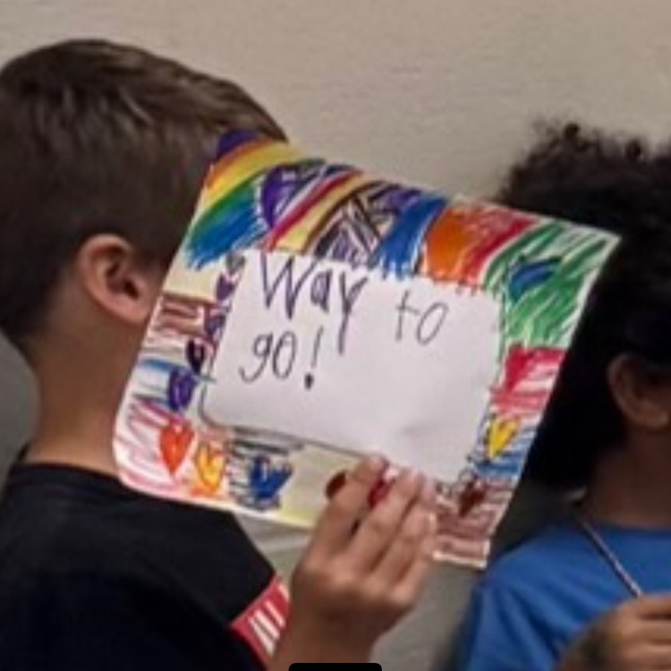 student with a sign