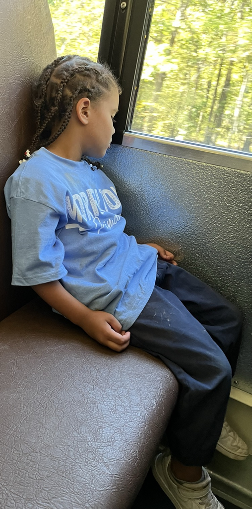 child asleep on bus