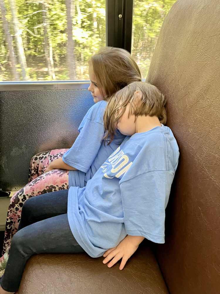 child asleep on bus