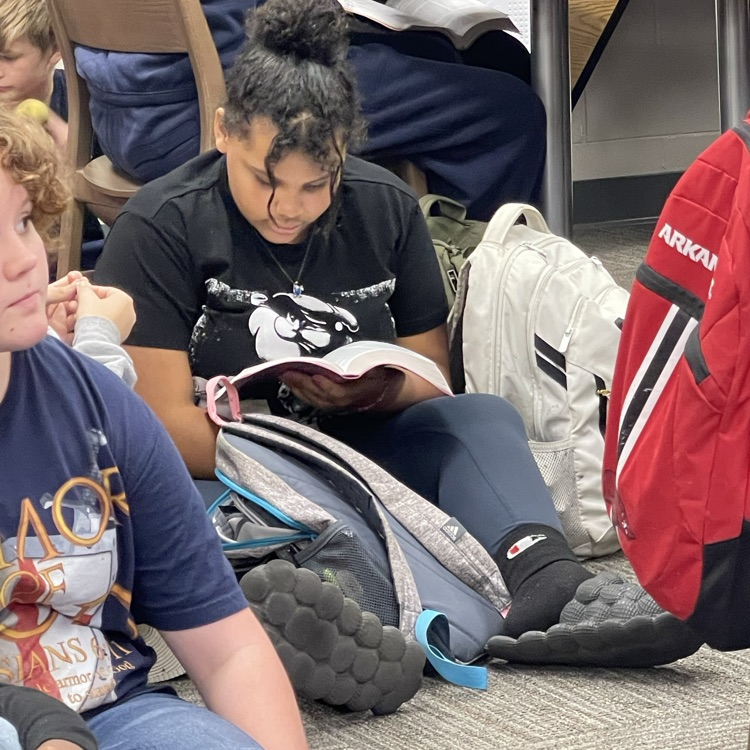 students reading their bible