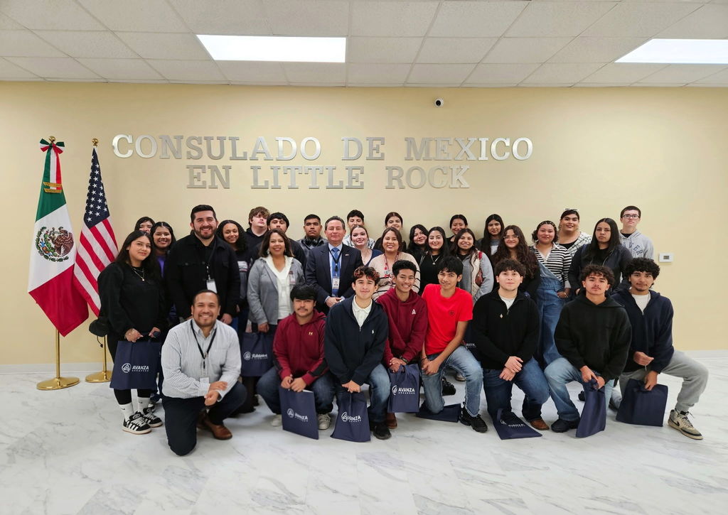 group of students and adults posing inside the Mexican Consulate building