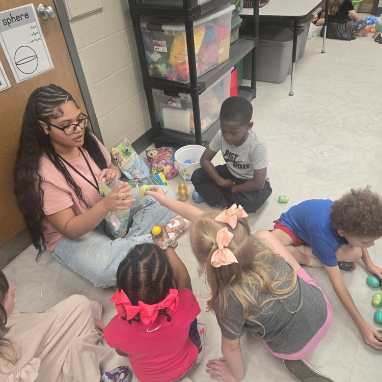 students working with a high school student 