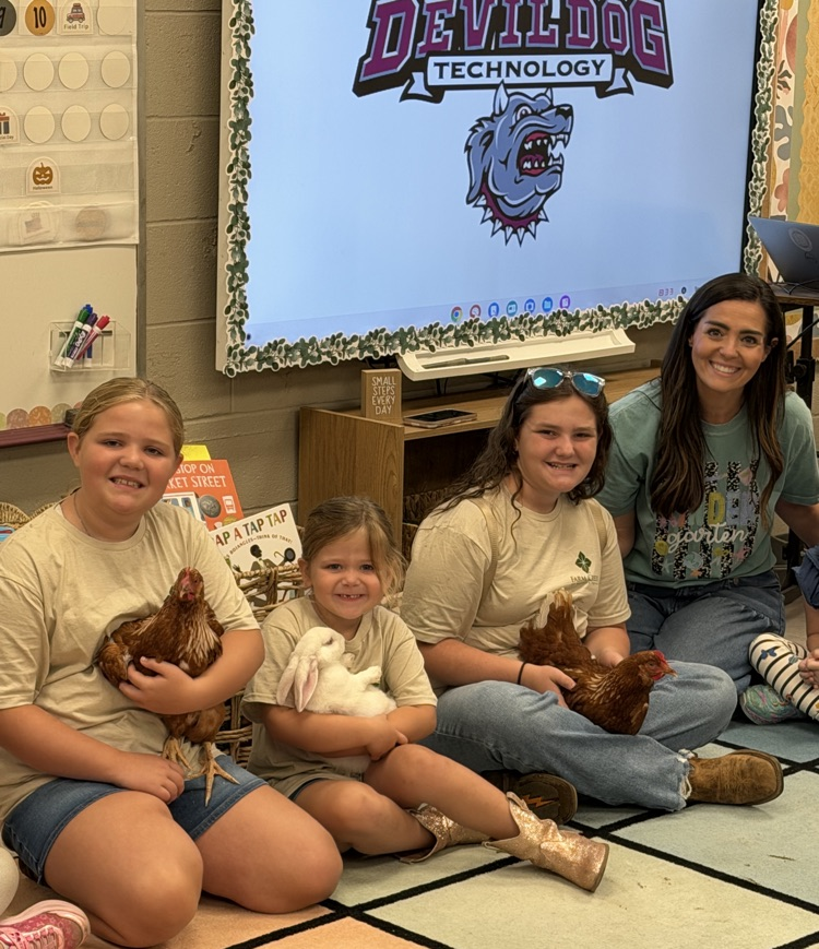 the Dixon Girls with some farm animals