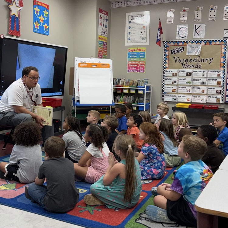 superintendent reading to children 